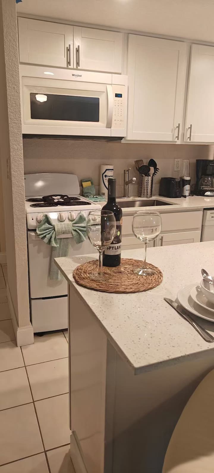 Kitchen countertop with wine bottle and glass