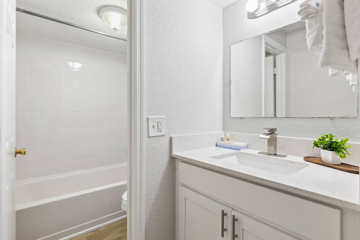 Bright modern bathroom with vanity and tub
