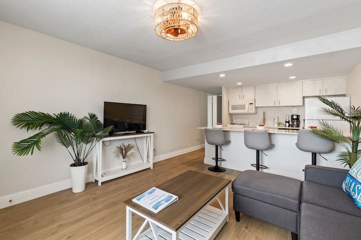 Modern open-concept living room with kitchen