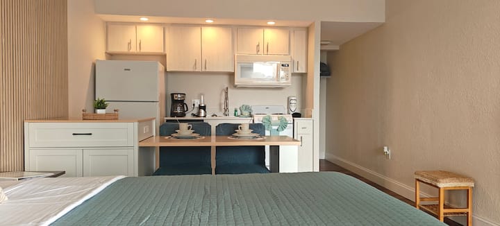 Studio apartment with kitchenette and bed