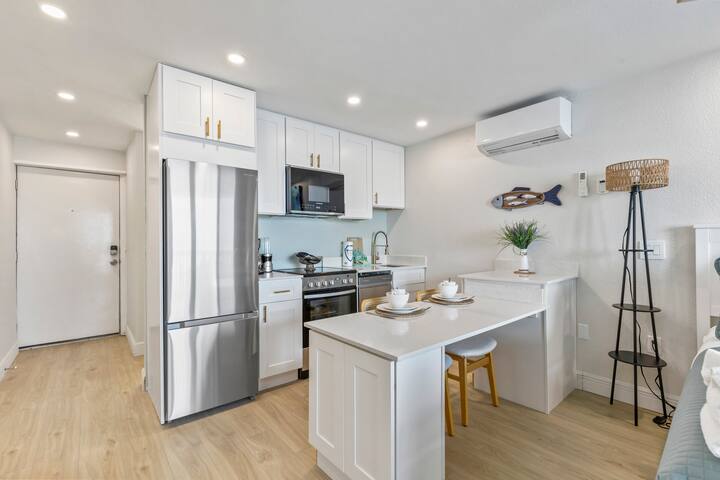 Bright modern kitchen with island breakfast bar