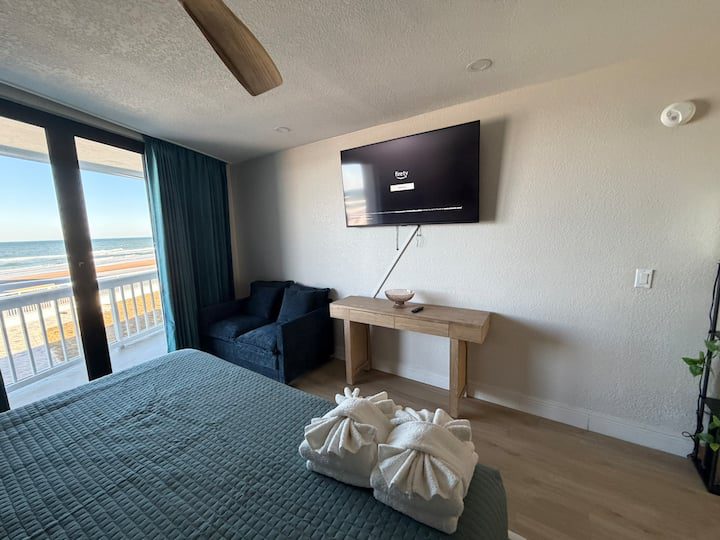 Beachfront bedroom with ocean view balcony