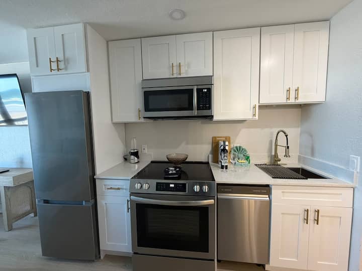 Compact modern kitchen with stainless appliances