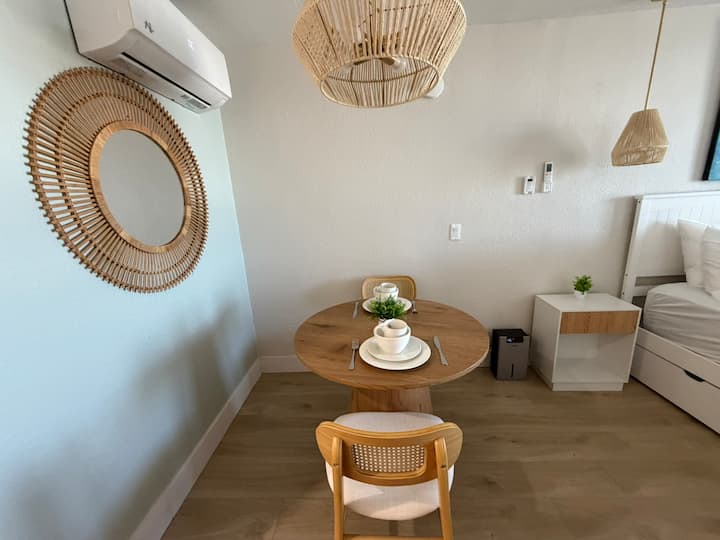 Round wooden table set for two