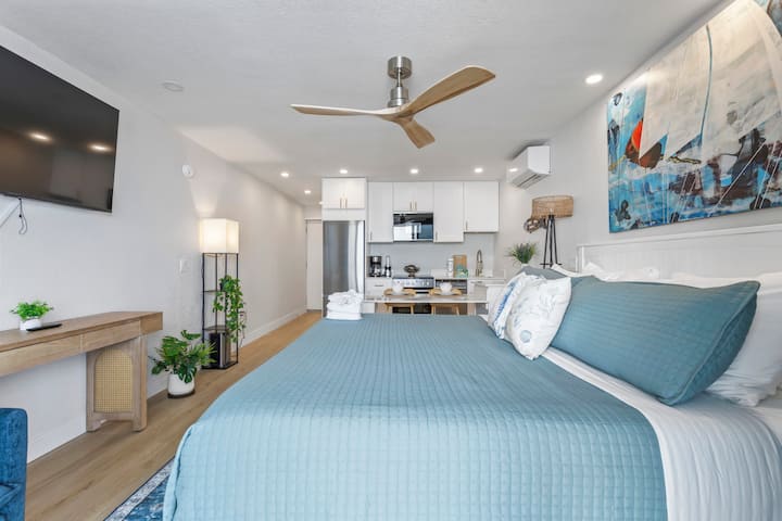 Contemporary studio bedroom with teal bedding