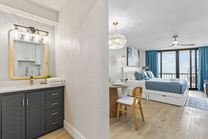 Bright modern studio with balcony and vanity