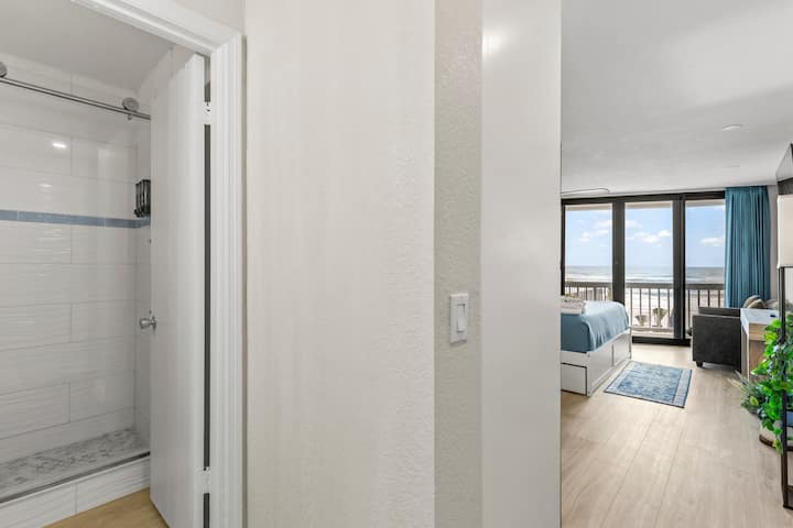 Ocean view bedroom suite with balcony and bathroom