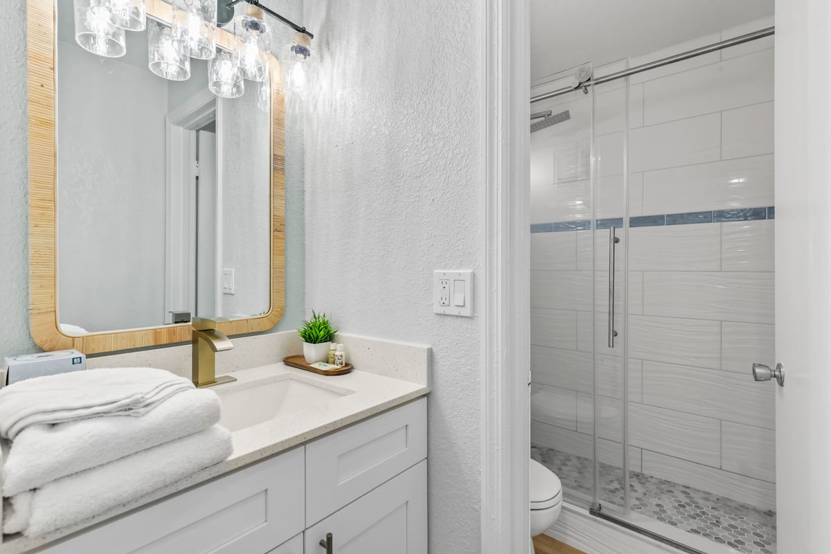 Bright modern bathroom with glass shower