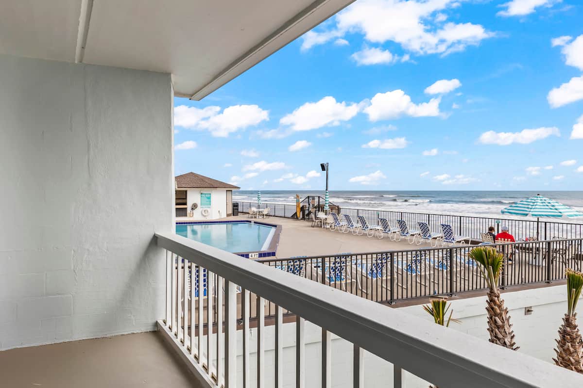 Oceanfront balcony view of pool and beach