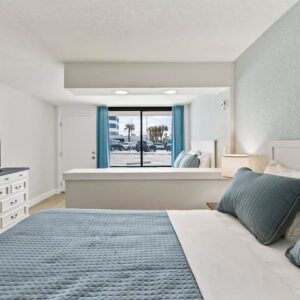 Bright beachfront bedroom with ocean view