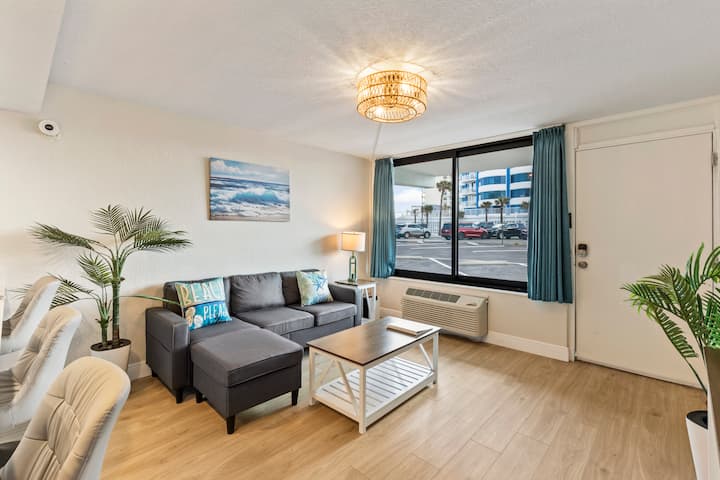 Bright beachfront suite living room with chaise