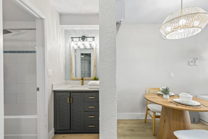 Modern bathroom vanity adjacent to dining nook