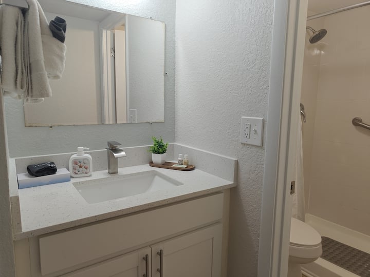 Modern bathroom vanity with sink and shower