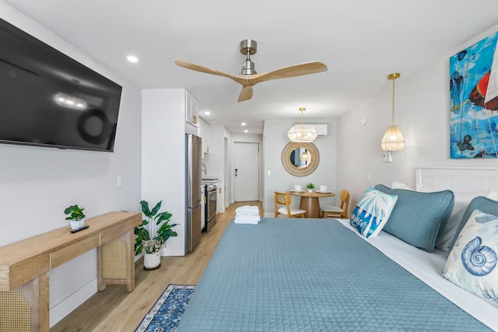 Modern studio bedroom with blue bedding