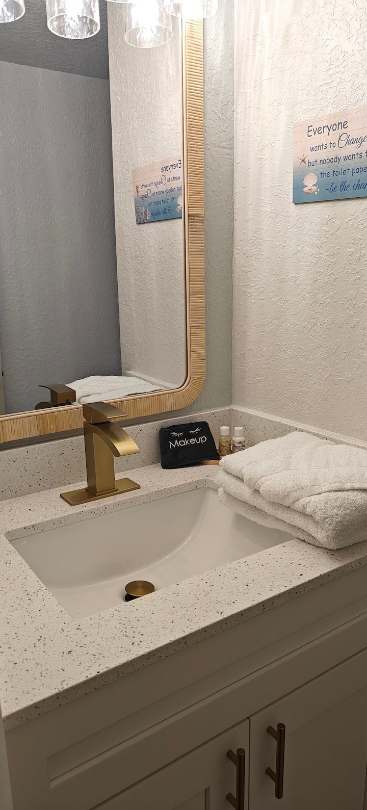 Modern bathroom sink with gold faucet
