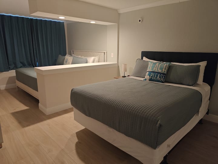 Modern bedroom with two beds and divider