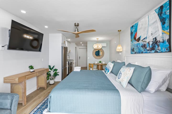 Bright coastal bedroom with teal bedding