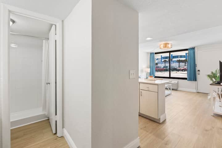 Studio apartment interior with kitchenette and window