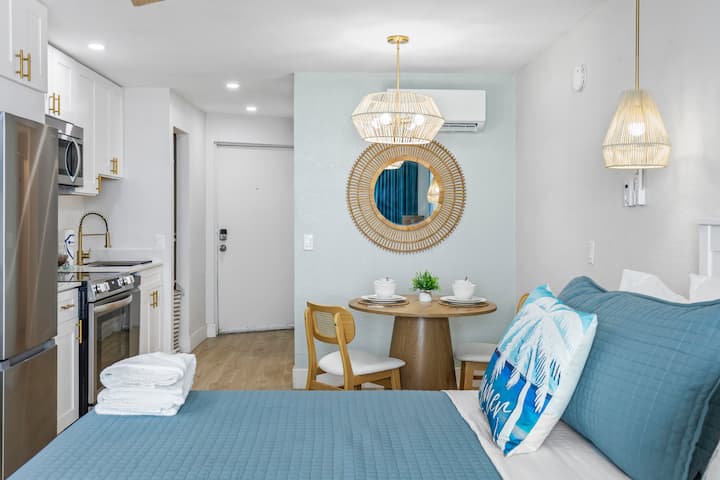 Compact beach themed studio with dining nook