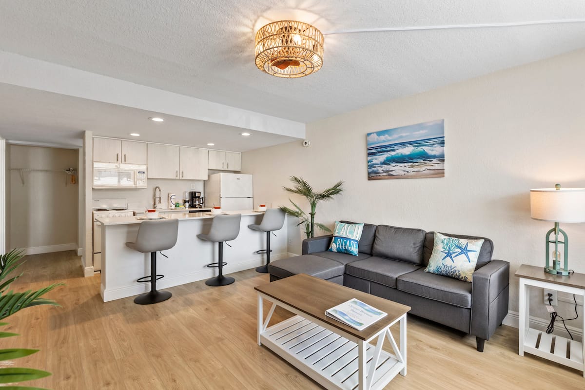 Coastal-inspired living room with breakfast bar